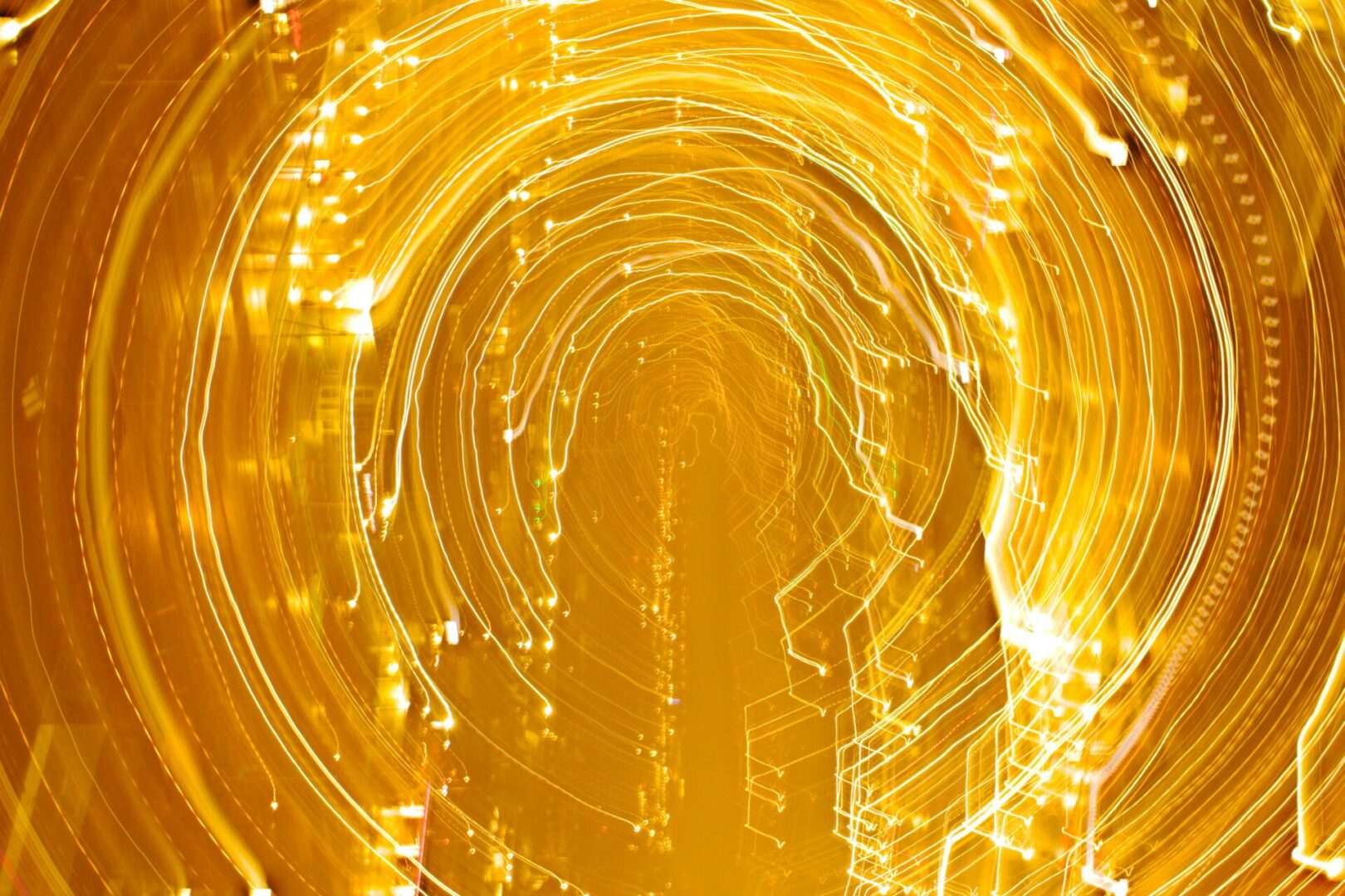 danielle-claude-belanger-rIVTGIfdJtk-unsplash A yellow background with lights and swirls