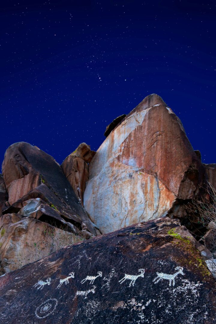 john-fowler-L8BaE93p2CI-unsplash A rock formation with a sky background